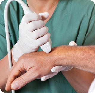 A doctor uses an ultrasound wand to diagnose a patient's wrist problem